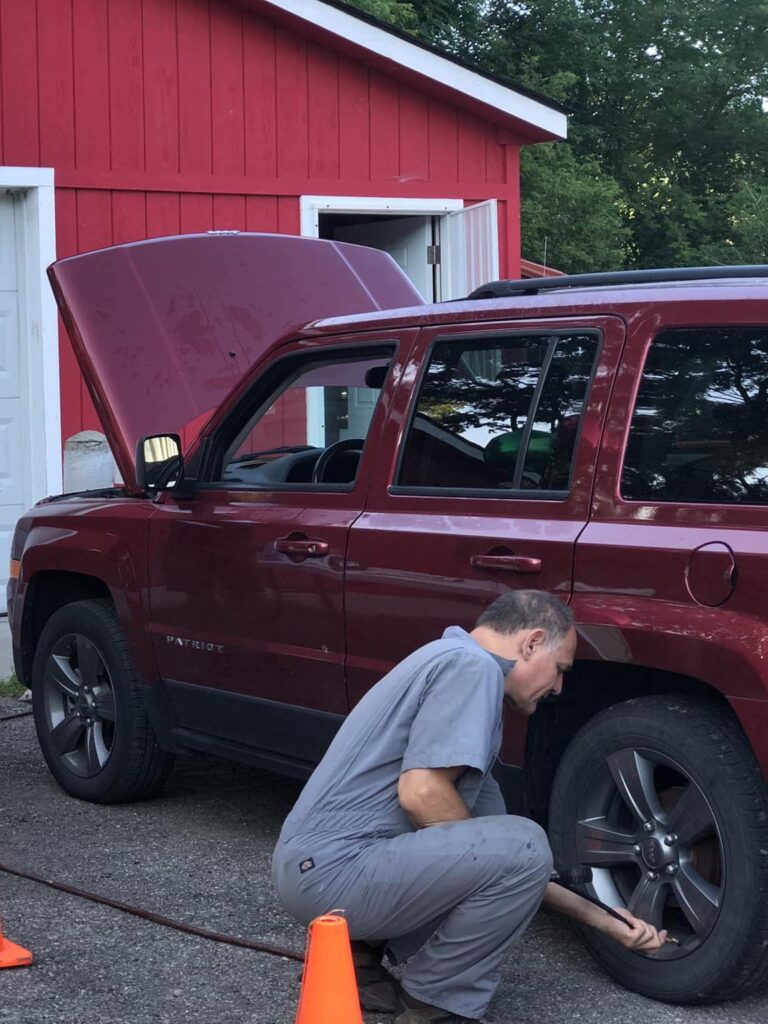 Mechanic working on auto at Car Care