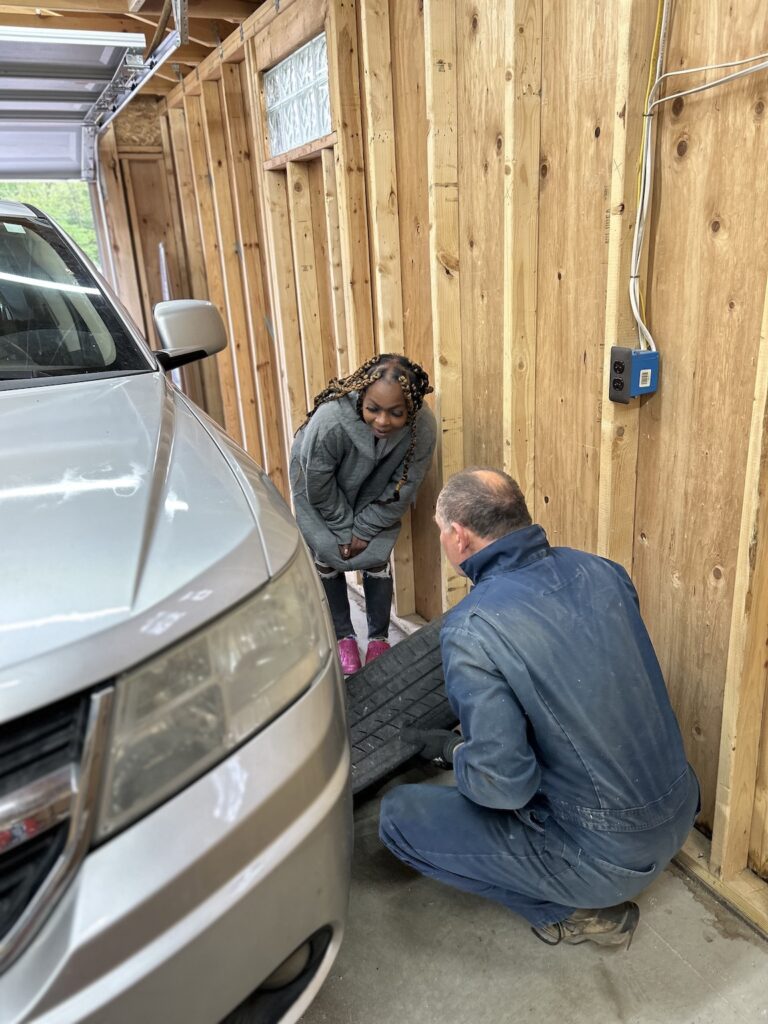 Mechanic working on auto at Car Care